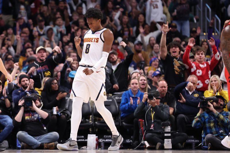 DENVER, COLORADO - NOVEMBER 04: Peyton Watson #8 of the Denver Nuggets reacts to a made basket against the Toronto Raptors in the fourth quarter at Ball Arena on November 4, 2024 in Denver, Colorado. NOTE TO USER: User expressly acknowledges and agrees that, by downloading and/or using this Photograph, user is consenting to the terms and conditions of the Getty Images License Agreement. Mandatory Copyright Notice: Copyright 2024 NBAE (Photo by Justin Tafoya/Getty Images)