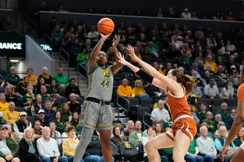 Feb 1, 2024; Waco, Texas, USA; Baylor Lady Bears forward Dre'Una Edwards (44) shoots against Texas Longhorns forward Taylor Jones (44) during the first half at Paul and Alejandra Foster Pavilion. Mandatory Credit: Chris Jones-USA TODAY Sports