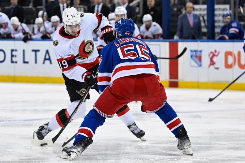 Jan 21, 2025; New York, New York, USA;  Ottawa Senators right wing Drake Batherson (19) attempts a shot defended by New York Rangers defenseman Ryan Lindgren (55) during the third period at Madison Square Garden. Mandatory Credit: Dennis Schneidler-Imagn Images