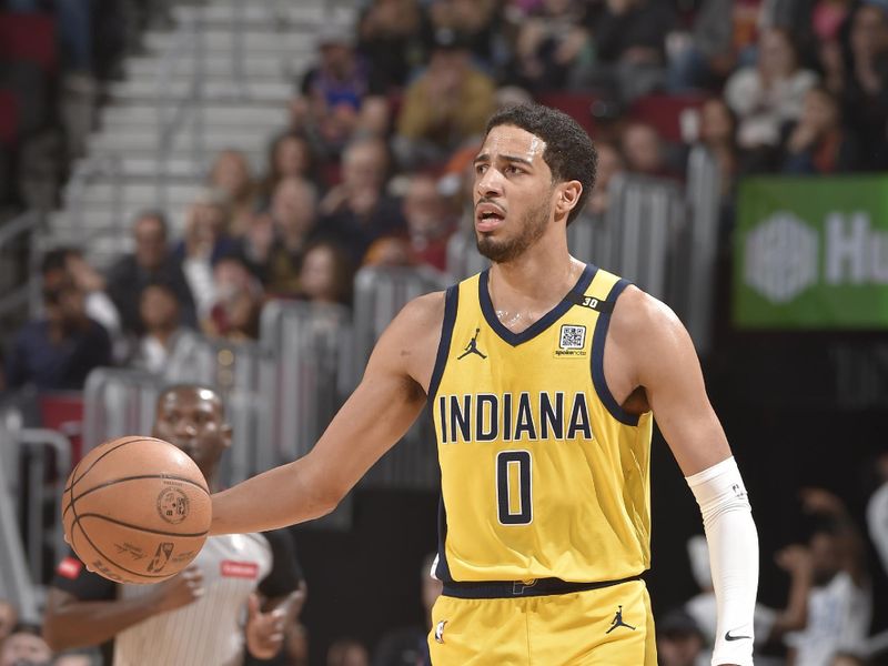 CLEVELAND, OH - APRIL 12: Tyrese Haliburton #0 of the Indiana Pacers dribbles the ball during the game against the Cleveland Cavaliers on April 12, 2024 at Rocket Mortgage FieldHouse in Cleveland, Ohio. NOTE TO USER: User expressly acknowledges and agrees that, by downloading and/or using this Photograph, user is consenting to the terms and conditions of the Getty Images License Agreement. Mandatory Copyright Notice: Copyright 2024 NBAE (Photo by David Liam Kyle/NBAE via Getty Images)