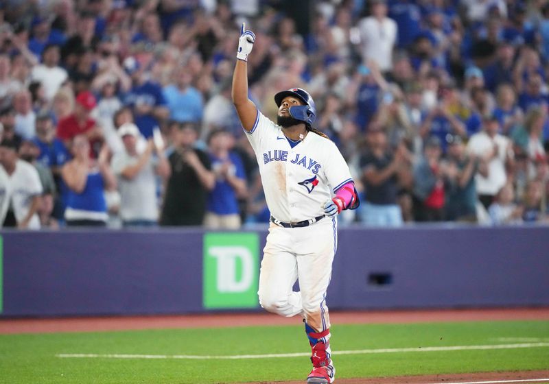 Aug 25, 2023; Toronto, Ontario, CAN; Toronto Blue Jays first baseman Vladimir Guerrero Jr. (27) celebrates after hitting a home run against the Cleveland Guardians during the sixth inning at Rogers Centre. Mandatory Credit: Nick Turchiaro-USA TODAY Sports