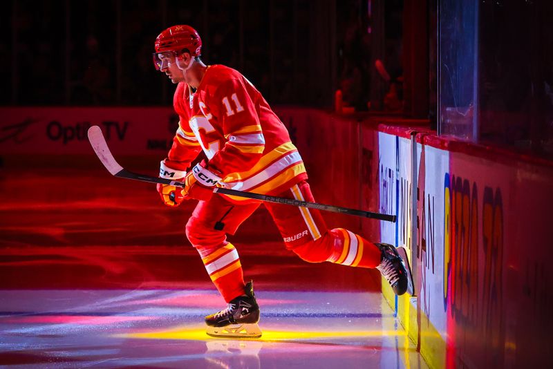 Jan 18, 2024; Calgary, Alberta, CAN; Calgary Flames center Mikael Backlund (11) takes the ice prior to the game against the Toronto Maple Leafs at Scotiabank Saddledome. Mandatory Credit: Sergei Belski-USA TODAY Sports