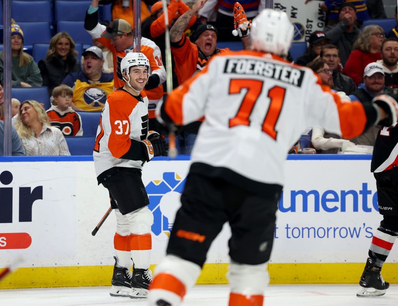 Nov 3, 2023; Buffalo, New York, USA;  Philadelphia Flyers defensemen Louie Belpedio (37) reacts after scoring a goal during the first period against the Buffalo Sabres at KeyBank Center. Mandatory Credit: Timothy T. Ludwig-USA TODAY Sports