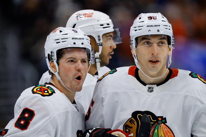 Oct 28, 2024; Denver, Colorado, USA; Chicago Blackhawks center Ryan Donato (8) celebrates his goal with right wing Ilya Mikheyev (95) in the third period against the Colorado Avalanche at Ball Arena. Mandatory Credit: Isaiah J. Downing-Imagn Images