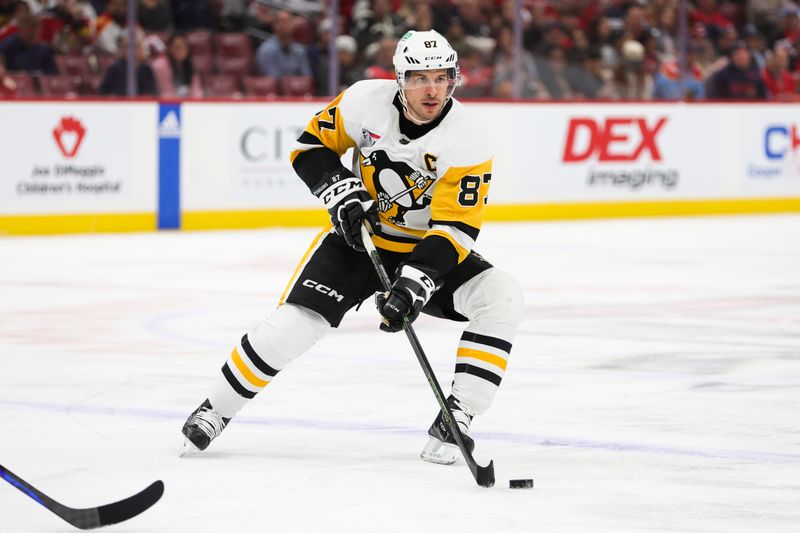 Dec 8, 2023; Sunrise, Florida, USA; Pittsburgh Penguins center Sidney Crosby (87) moves the puck against the Florida Panthers during the first period at Amerant Bank Arena. Mandatory Credit: Sam Navarro-USA TODAY Sports