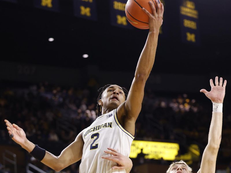 Feb 8, 2023; Ann Arbor, Michigan, USA;  Michigan Wolverines guard Kobe Bufkin (2) shoots on Nebraska Cornhuskers guard Sam Griesel (5) in the first half at Crisler Center. Mandatory Credit: Rick Osentoski-USA TODAY Sports