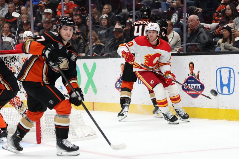 Dec 21, 2023; Anaheim, California, USA;  Calgary Flames center Blake Coleman (20) passes the puck during the first period against the Anaheim Ducks at Honda Center. Mandatory Credit: Kiyoshi Mio-USA TODAY Sports