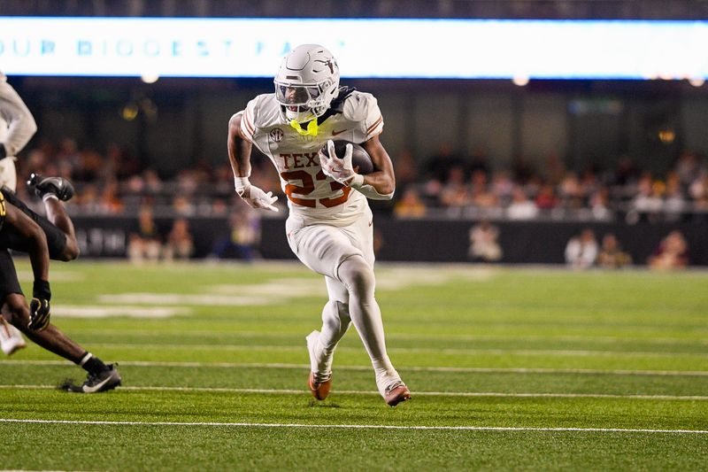 Oct 26, 2024; Nashville, Tennessee, USA;  Texas Longhorns running back Jaydon Blue (23) runs the ball against the Vanderbilt Commodores during the second half at FirstBank Stadium. Mandatory Credit: Steve Roberts-Imagn Images