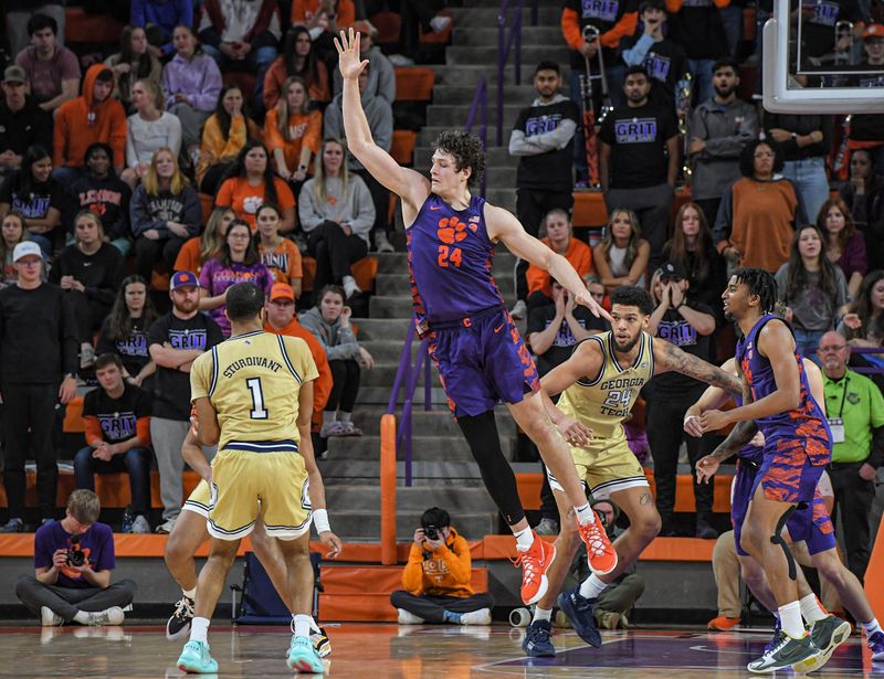 Jan 24, 2023; Clemson, South Carolina, USA; Clemson Tigers center PJ Hall (24) defends against Georgia Tech Yellow Jackets guard Kyle Sturdivant (1) during the second half at Littlejohn Coliseum. Mandatory Credit: Ken Ruinard-USA TODAY Sports