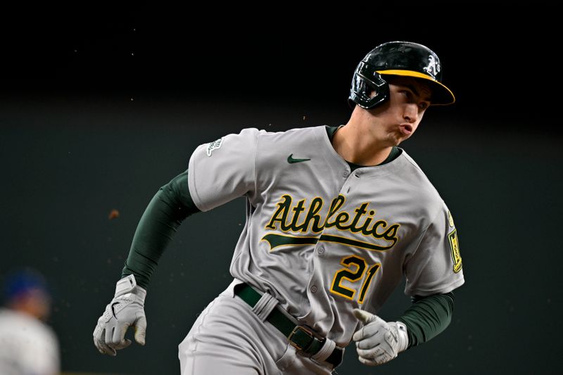May 1, 2025; Arlington, Texas, USA; Athletics left fielder Tyler Soderstrom (21) scores against the Texas Rangers during the first inning at Globe Life Field. Mandatory Credit: Jerome Miron-Imagn Images
