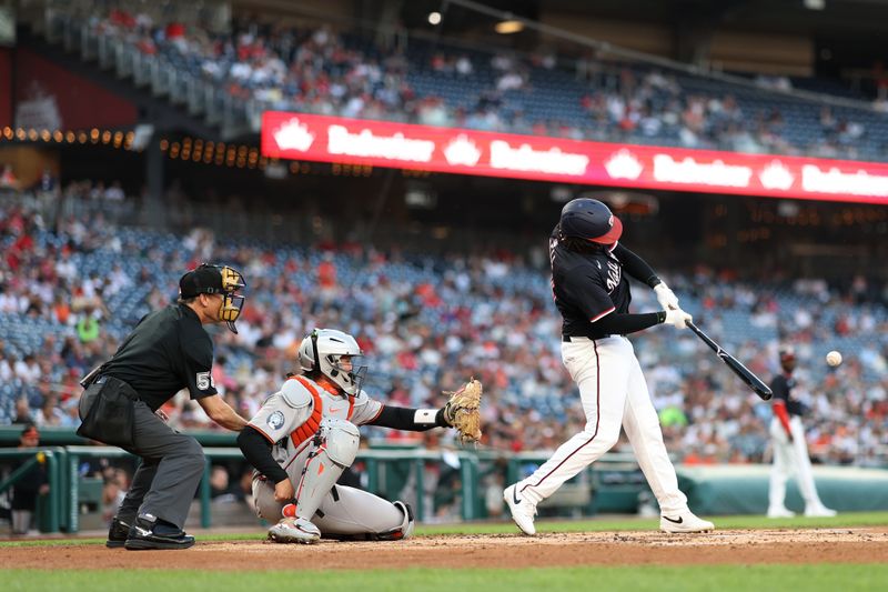 Apr 24, 2025; Washington, District of Columbia, USA; Washington Nationals first base Josh Bell (19) hits an RBI single against the Baltimore Orioles during the second inning at Nationals Park. Mandatory Credit: Geoff Burke-Imagn Images