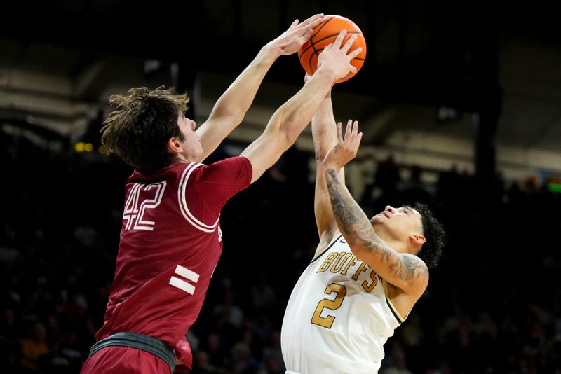 Mar 3, 2024; Boulder, Colorado, USA; Stanford Cardinal forward Maxime Raynaud (42) blocks the shot of Colorado Buffaloes guard KJ Simpson (2) in the second half at the CU Events Center. Mandatory Credit: Ron Chenoy-USA TODAY Sports