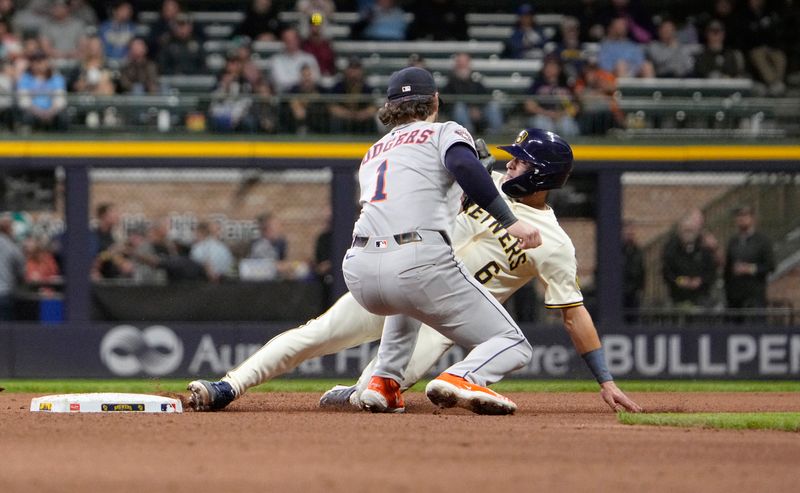 May 6, 2025; Milwaukee, Wisconsin, USA; Milwaukee Brewers outfielder Isaac Collins (6) steals second base ahead of the tag by Houston Astros second base Brendan Rodgers (1) in the sixth inning at American Family Field. Mandatory Credit: Michael McLoone-Imagn Images