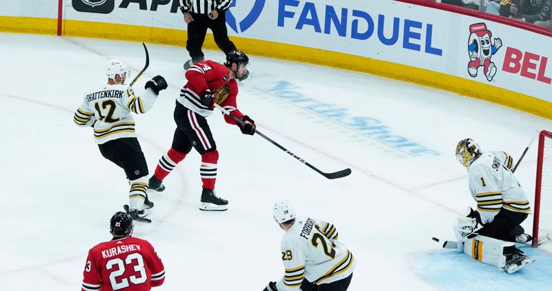 Oct 24, 2023; Chicago, Illinois, USA; Boston Bruins goaltender Jeremy Swayman (1) makes a save on Chicago Blackhawks left wing Boris Katchouk (14) during the second period at United Center. Mandatory Credit: David Banks-USA TODAY Sports