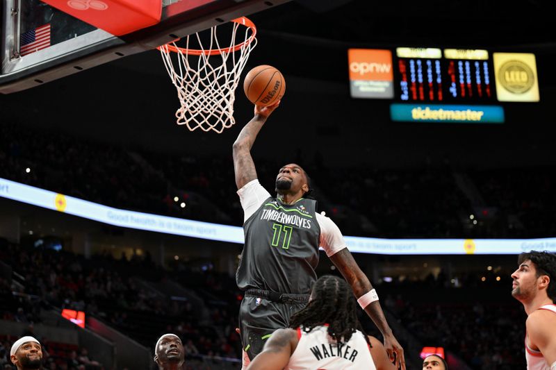 PORTLAND, OREGON - NOVEMBER 13: Naz Reid #11 of the Minnesota Timberwolves dunks during the first quarter of the game against the Portland Trail Blazers at Moda Center on November 13, 2024 in Portland, Oregon. NOTE TO USER: User expressly acknowledges and agrees that, by downloading and or using this photograph, User is consenting to the terms and conditions of the Getty Images License Agreement. (Photo by Alika Jenner/Getty Images)