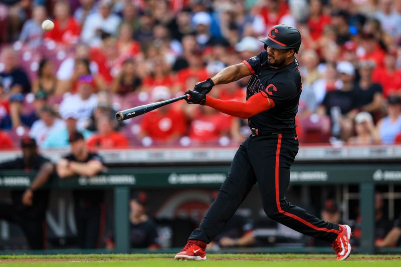 Jul 12, 2024; Cincinnati, Ohio, USA; Cincinnati Reds designated hitter Jeimer Candelario (3) hits a solo home run in the first inning against the Miami Marlins at Great American Ball Park. Mandatory Credit: Katie Stratman-USA TODAY Sports