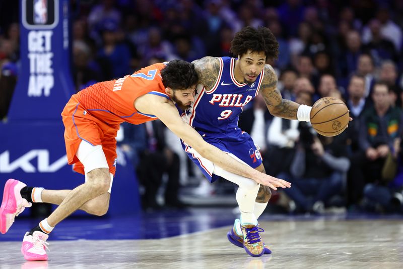 PHILADELPHIA, PENNSYLVANIA - APRIL 02: Kelly Oubre Jr. #9 of the Philadelphia 76ers steals the ball from Chet Holmgren #7 of the Oklahoma City Thunder during the fourth quarter at the Wells Fargo Center on April 02, 2024 in Philadelphia, Pennsylvania. NOTE TO USER: User expressly acknowledges and agrees that, by downloading and or using this photograph, User is consenting to the terms and conditions of the Getty Images License Agreement. (Photo by Tim Nwachukwu/Getty Images)