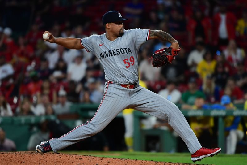 May 3, 2025; Boston, Massachusetts, USA; Minnesota Twins relief pitcher Jhoan Duran (59) pitches during the ninth inning against the Boston Red Sox at Fenway Park. Mandatory Credit: Bob DeChiara-Imagn Images