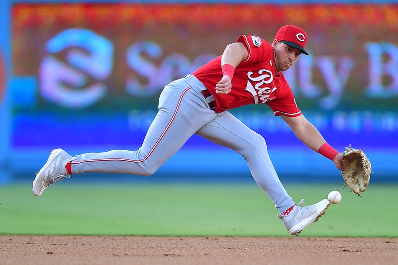 Jul 29, 2023; Los Angeles, California, USA; Cincinnati Reds third baseman Spencer Steer (7) plays for the fielders choice of Los Angeles Dodgers first baseman Freddie Freeman (5) during the first inning at Dodger Stadium. Mandatory Credit: Gary A. Vasquez-USA TODAY Sports