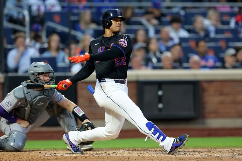 May 30, 2025; New York City, New York, USA; New York Mets right fielder Juan Soto (22) follows through on an RBI double against the Colorado Rockies during the third inning at Citi Field. Mandatory Credit: Brad Penner-Imagn Images