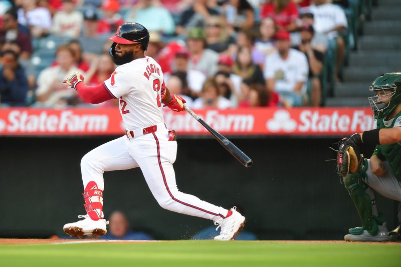 Jul 26, 2024; Anaheim, California, USA; Los Angeles Angels second baseman Luis Rengifo (2) hits a single against the Oakland Athletics during the first inning at Angel Stadium. Mandatory Credit: Gary A. Vasquez-USA TODAY Sports