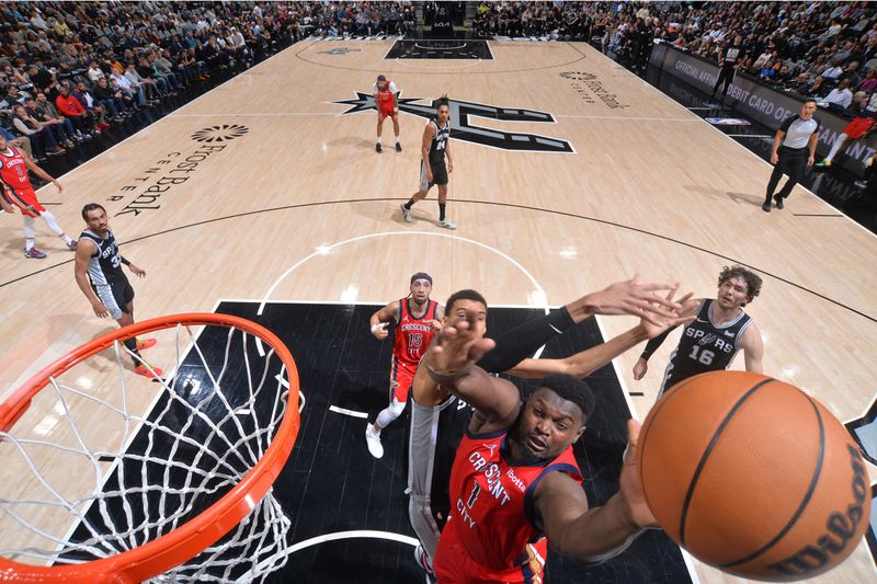 SAN ANTONIO, TX - FEBRUARY 2:  Zion Williamson #1 of the New Orleans Pelicans drives to the basket during the game as Victor Wembanyama #1 of the San Antonio Spurs plays defense on February 2, 2024 at the Frost Bank Center in San Antonio, Texas. NOTE TO USER: User expressly acknowledges and agrees that, by downloading and or using this photograph, user is consenting to the terms and conditions of the Getty Images License Agreement. Mandatory Copyright Notice: Copyright 2024 NBAE (Photos by Michael Gonzales/NBAE via Getty Images)