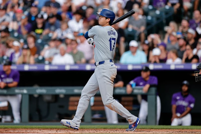 Jun 17, 2024; Denver, Colorado, USA; Los Angeles Dodgers designated hitter Shohei Ohtani (17) hits a double in the fourth inning against the Colorado Rockies at Coors Field. Mandatory Credit: Isaiah J. Downing-USA TODAY Sports