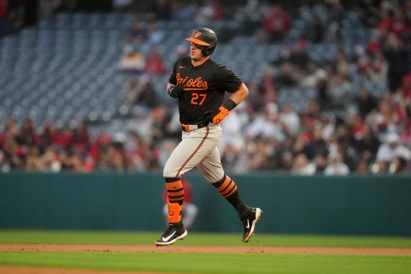 Apr 22, 2024; Anaheim, California, USA; Baltimore Orioles catcher James McCann (27) runs the bases after a solo home run in the second inning against the Los Angeles Angels at Angel Stadium. Mandatory Credit: Kirby Lee-USA TODAY Sports