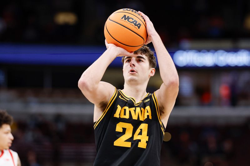Mar 12, 2026; Chicago, IL, USA; Iowa Hawkeyes guard Tate Sage (24) shoots a free throw against the Ohio State Buckeyes during the first half at United Center. Mandatory Credit: Kamil Krzaczynski-Imagn Images