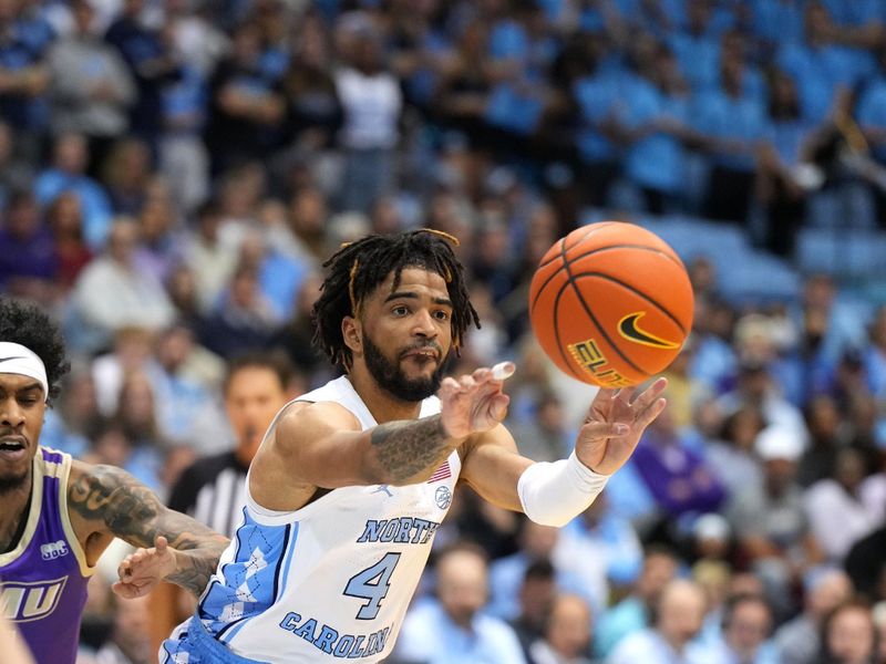 Nov 20, 2022; Chapel Hill, North Carolina, USA; North Carolina Tar Heels guard R.J. Davis (4) passes the ball in the second half at Dean E. Smith Center. Mandatory Credit: Bob Donnan-USA TODAY Sports