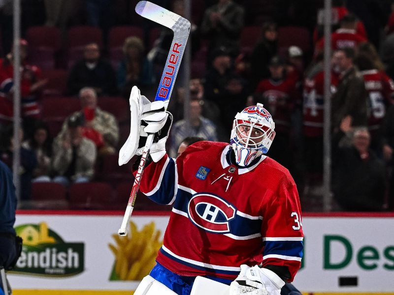 Oct 28, 2023; Montreal, Quebec, CAN; Montreal Canadiens goalie Jake Allen (34), third star of the night, salutes the crowd after the end of the game against the Winnipeg Jets  at Bell Centre. Mandatory Credit: David Kirouac-USA TODAY Sports