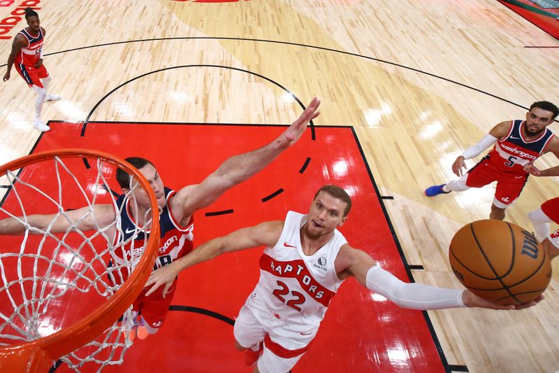 TORONTO, CANADA - OCTOBER 20: Malachi Flynn #22 of the Toronto Raptors drives to the basket during the game against the Washington Wizards on October 20, 2023 at the Scotiabank Arena in Toronto, Ontario, Canada.  NOTE TO USER: User expressly acknowledges and agrees that, by downloading and or using this Photograph, user is consenting to the terms and conditions of the Getty Images License Agreement.  Mandatory Copyright Notice: Copyright 2023 NBAE (Photo by Vaughn Ridley/NBAE via Getty Images)