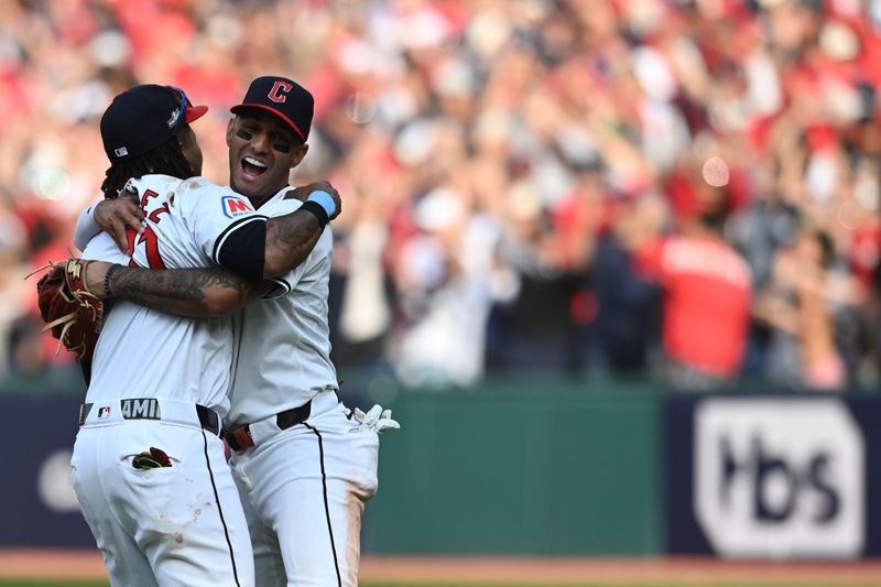 Oct 12, 2024; Cleveland, Ohio, USA; Cleveland Guardians third base José Ramírez (11) celebrates with shortstop Brayan Rocchio (4) after defeating the Detroit Tigers during game five of the ALDS for the 2024 MLB Playoffs at Progressive Field. Mandatory Credit: Ken Blaze-Imagn Images