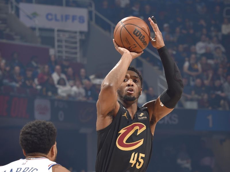 CLEVELAND, OH - MARCH 15: Donovan Mitchell #45 of the Cleveland Cavaliers shoots the ball during the game against the Philadelphia 76ers on March 15, 2023 at Rocket Mortgage FieldHouse in Cleveland, Ohio. NOTE TO USER: User expressly acknowledges and agrees that, by downloading and/or using this Photograph, user is consenting to the terms and conditions of the Getty Images License Agreement. Mandatory Copyright Notice: Copyright 2023 NBAE (Photo by David Liam Kyle/NBAE via Getty Images)