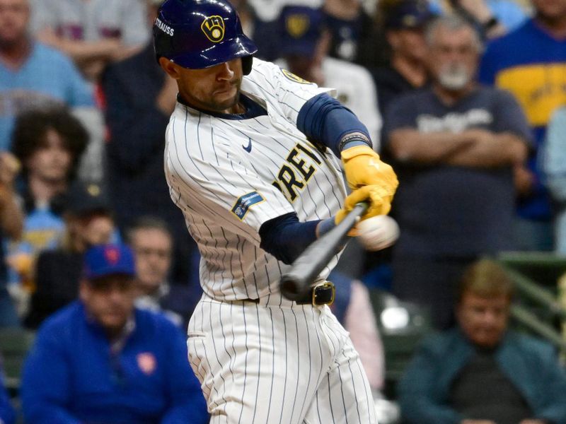 Oct 2, 2024; Milwaukee, Wisconsin, USA; Milwaukee Brewers outfielder Blake Perkins (16) hits a sacrifice fly during the fifth inning in game two of the Wildcard round for the 2024 MLB Playoffs against the New York Mets at American Family Field. Mandatory Credit: Benny Sieu-Imagn Images