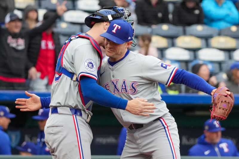 May 5, 2024; Kansas City, Missouri, USA; Texas Rangers pitcher David Robertson (37) celebrates with catcher Jonah Heim (28) after the win over the Kansas City Royals at Kauffman Stadium. Mandatory Credit: Denny Medley-USA TODAY Sports