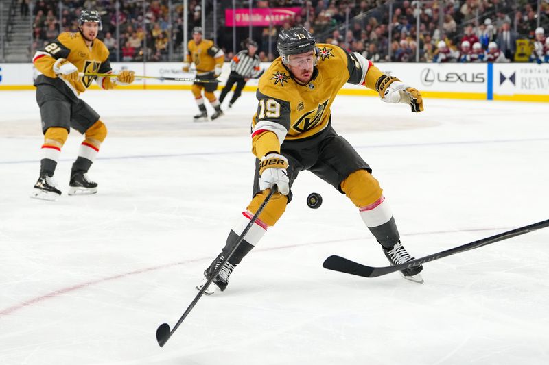 Dec 27, 2025; Las Vegas, Nevada, USA; Vegas Golden Knights right wing Reilly Smith (19) looks to deflect a puck cleared by the Colorado Avalanche during the second period at T-Mobile Arena. Mandatory Credit: Stephen R. Sylvanie-Imagn Images