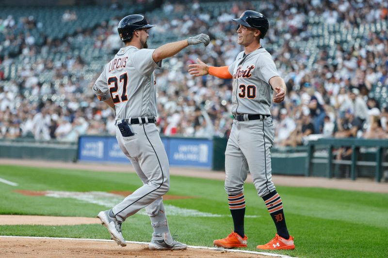 Sep 2, 2023; Chicago, Illinois, USA; Detroit Tigers second baseman Andre Lipcius (27) is greeted at home plate by right fielder Kerry Carpenter (30) after hitting a two-run home run against the Chicago White Sox during the first inning at Guaranteed Rate Field. Mandatory Credit: Kamil Krzaczynski-USA TODAY Sports