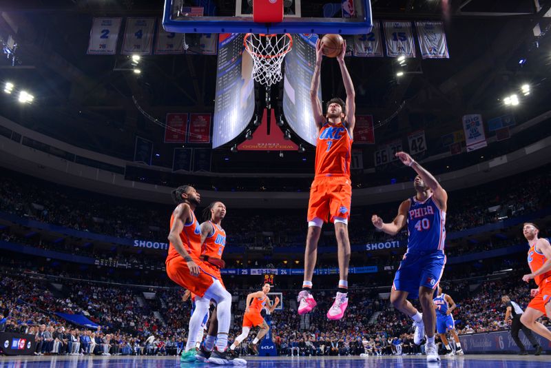 PHILADELPHIA, PA - APRIL 2: Chet Holmgren #7 of the Oklahoma City Thunder rebounds the ball during the game against the Philadelphia 76ers on April 2, 2024 at the Wells Fargo Center in Philadelphia, Pennsylvania NOTE TO USER: User expressly acknowledges and agrees that, by downloading and/or using this Photograph, user is consenting to the terms and conditions of the Getty Images License Agreement. Mandatory Copyright Notice: Copyright 2024 NBAE (Photo by Jesse D. Garrabrant/NBAE via Getty Images)