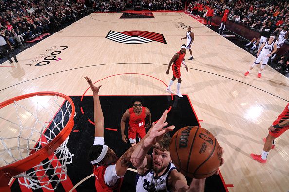 PORTLAND, OR - DECEMBER 26: Domantas Sabonis #10 of the Sacramento Kings drives to the basket during the game against the Portland Trail Blazers on December 26, 2023 at the Moda Center Arena in Portland, Oregon. NOTE TO USER: User expressly acknowledges and agrees that, by downloading and or using this photograph, user is consenting to the terms and conditions of the Getty Images License Agreement. Mandatory Copyright Notice: Copyright 2023 NBAE (Photo by Cameron Browne/NBAE via Getty Images)