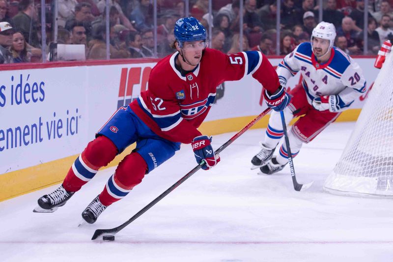 Oct 22, 2024; Ottawa, Ontario, CAN; Montreal Canadiens defenseman Justin Barron (52) skates with the puck away of New York Rangers left wing Chris Kreider (20) in the first period at the Bell Centre. Mandatory Credit: Marc DesRosiers-Imagn Images