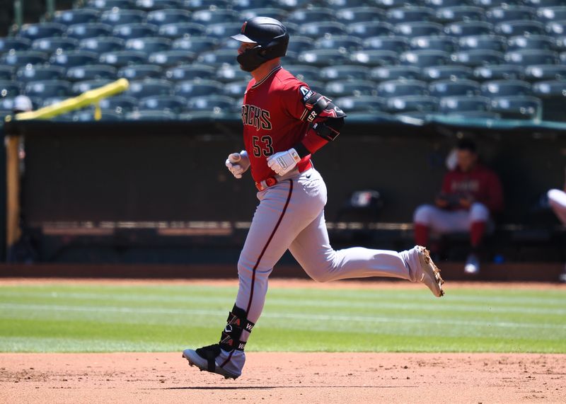 May 17, 2023; Oakland, California, USA; Arizona Diamondbacks first baseman Christian Walker (53) rounds the bases on a solo home run against the Oakland Athletics during the second inning at Oakland-Alameda County Coliseum. Mandatory Credit: Kelley L Cox-USA TODAY Sports