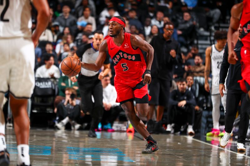 BROOKLYN, NY - OCTOBER 18: Immanuel Quickley #5 of the Toronto Raptors dribbles the ball during the game on October 18, 2024 at Barclays Center in Brooklyn, New York. NOTE TO USER: User expressly acknowledges and agrees that, by downloading and or using this Photograph, user is consenting to the terms and conditions of the Getty Images License Agreement. Mandatory Copyright Notice: Copyright 2024 NBAE (Photo by David L. Nemec/NBAE via Getty Images)