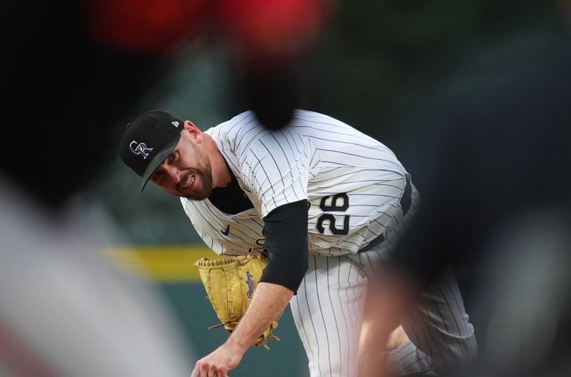 Aug 30, 2024; Denver, Colorado, USA; Colorado Rockies starting pitcher Austin Gomber (26) delivers a pitch in the first inning against the Baltimore Orioles  at Coors Field. Mandatory Credit: Ron Chenoy-USA TODAY Sports