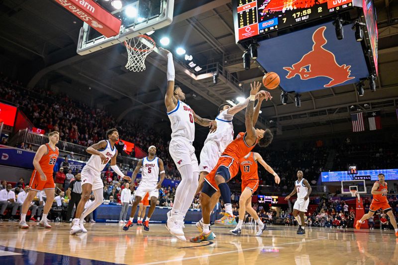 Jan 17, 2026; Dallas, Texas, USA; SMU Mustangs center Samet Yigitoglu (24) blocks a shot by Virginia Cavaliers guard Malik Thomas (1) during the first half at Moody Coliseum. Mandatory Credit: Jerome Miron-Imagn Images