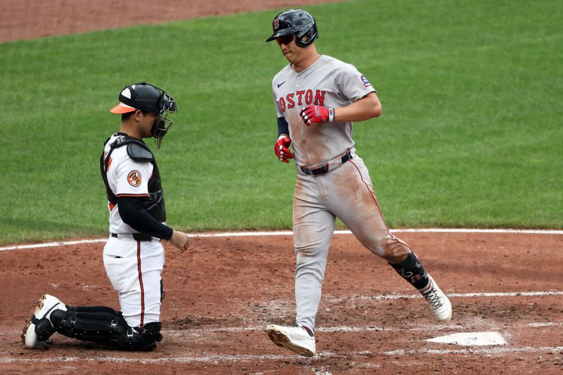 Aug 28, 2025; Baltimore, Maryland, USA; Boston Red Sox outfielder Rob Refsnyder (30) scores after hitting a solo home run during the fourth inning against the Baltimore Orioles at Oriole Park at Camden Yards. Mandatory Credit: Daniel Kucin Jr.-Imagn Images