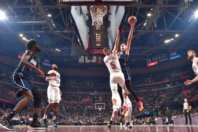 CLEVELAND, OH - FEBRUARY 22: Moritz Wagner #21 of the Orlando Magic drives to the basket during the game against the Cleveland Cavaliers on February 22, 2024 at Rocket Mortgage FieldHouse in Cleveland, Ohio. NOTE TO USER: User expressly acknowledges and agrees that, by downloading and/or using this Photograph, user is consenting to the terms and conditions of the Getty Images License Agreement. Mandatory Copyright Notice: Copyright 2024 NBAE (Photo by David Liam Kyle/NBAE via Getty Images)