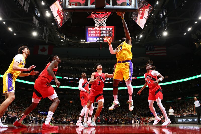 TORONTO, CANADA - NOVEMBER 1: LeBron James #23 of the Los Angeles Lakers drives to the basket during the game against the Toronto Raptors on November 1, 2024 at the Scotiabank Arena in Toronto, Ontario, Canada.  NOTE TO USER: User expressly acknowledges and agrees that, by downloading and or using this Photograph, user is consenting to the terms and conditions of the Getty Images License Agreement.  Mandatory Copyright Notice: Copyright 2024 NBAE (Photo by Vaughn Ridley/NBAE via Getty Images)