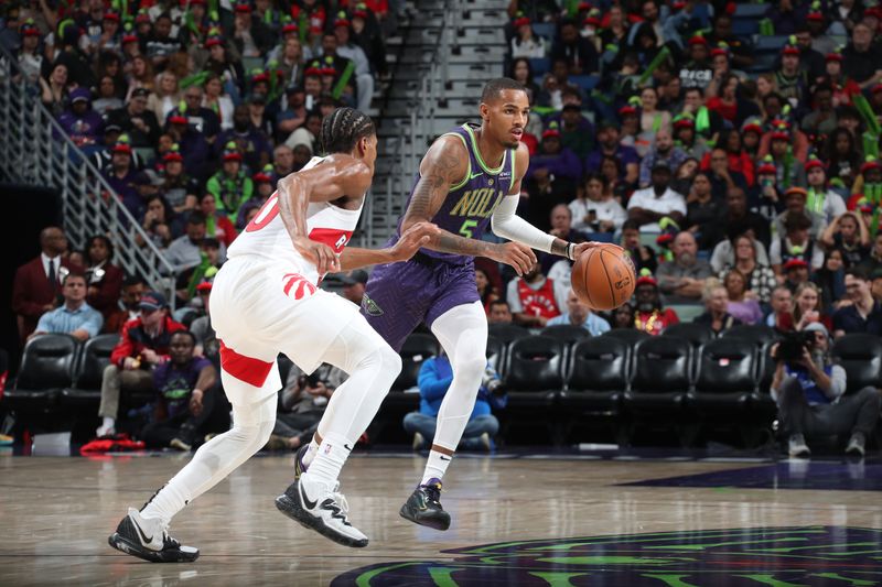 NEW ORLEANS, LA - NOVEMBER 27:  Dejounte Murray #5 of the New Orleans Pelicans dribbles the ball during the game against the Toronto Raptors  during a regular season game on November 27, 2024 at the Smoothie King Center in New Orleans, Louisiana. NOTE TO USER: User expressly acknowledges and agrees that, by downloading and or using this Photograph, user is consenting to the terms and conditions of the Getty Images License Agreement. Mandatory Copyright Notice: Copyright 2024 NBAE (Photo by Layne Murdoch Jr./NBAE via Getty Images)