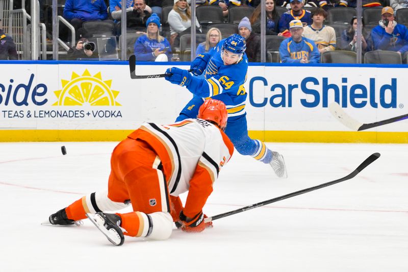Dec 1, 2025; St. Louis, Missouri, USA; St. Louis Blues right wing Dalibor Dvorsky (54) shoots as Anaheim Ducks defenseman Jackson LaCombe (2) defends during the second period at Enterprise Center. Mandatory Credit: Jeff Curry-Imagn Images